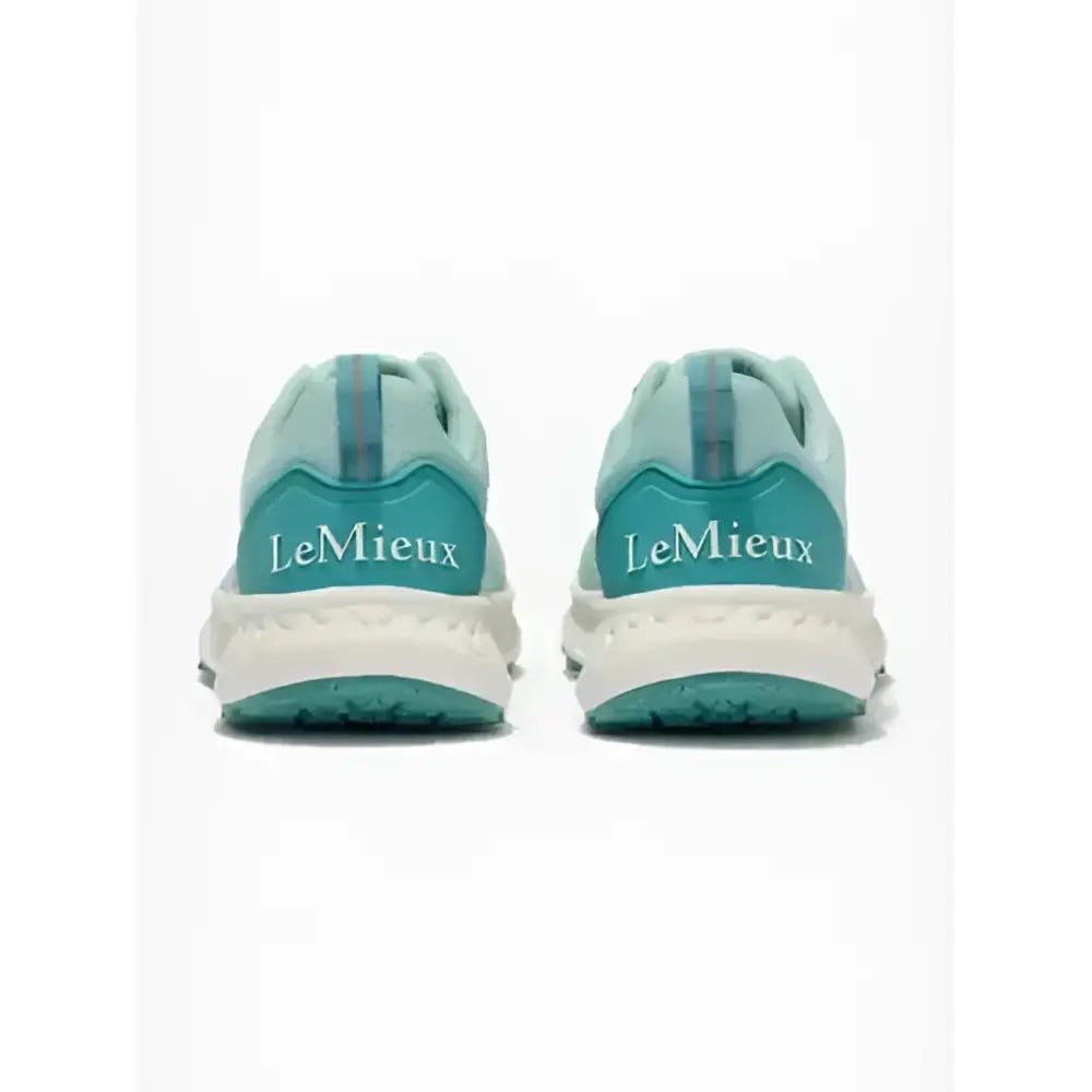 Teal and white lemieux youth trax-lite trainer aqua with mesh upper and textured rubber sole perfect for equestrian use