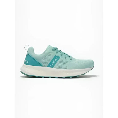 A mint green lemieux youth trainer aqua mesh running shoe with teal accents and a white sole for equestrian use