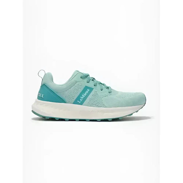 A mint green lemieux youth trainer aqua mesh running shoe with teal accents and a white sole for equestrian use
