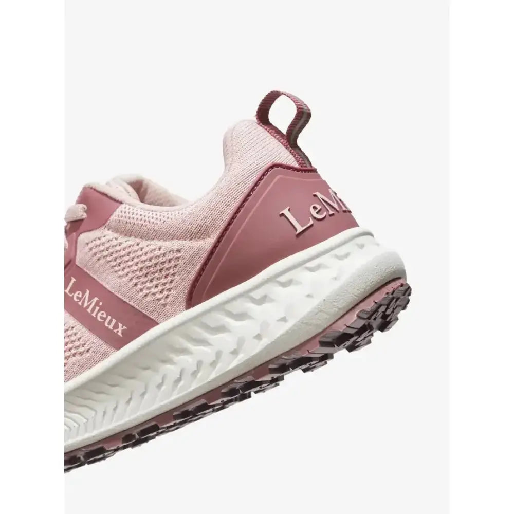 A blush pink lemieux youth trainer blossom sneaker with mesh upper and maroon equestrian accents on heel and outsole