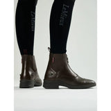 Brown leather lemieux zip paddock boot with zipper closure and black rubber soles perfect for riding