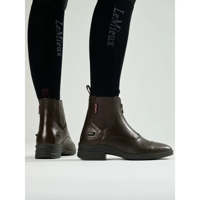 Brown leather lemieux zip paddock boot with zipper closure and black rubber soles perfect for riding