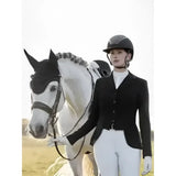 Black equestrian helmet with matte finish and subtle branding paired with lemieux zoe jacket navy