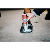 Leovet hoof lab hoof hardener in white and red can being applied to dark brown horse hoof to protect nail holes