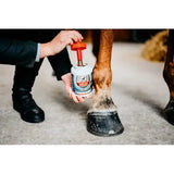 White cylindrical container with red cap and blue label branded hufal leovet hoof lab hoof lab oil for horse hoof care