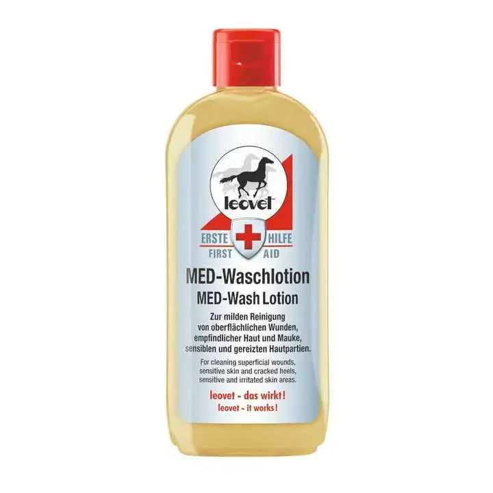 A clear plastic bottle with red cap contains yellowish leovet med wash lotion for cleaning wounds and sensitive skin