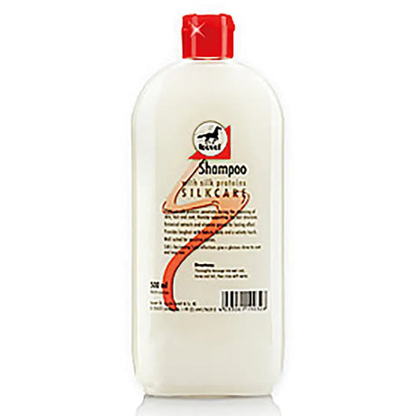 A white plastic bottle of leovet silkcare shampoo with a red cap and label featuring silk proteins bind logo