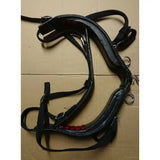 Black leather harness with red stitching and metal hardware from libbys driving saddle featuring webbing tugs and belly band