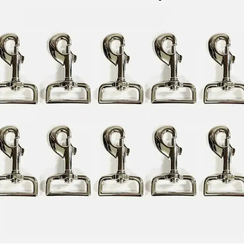 Shiny silver lightweight trigger clips made of metal arranged in two rows perfect as horse rug clips and horse tack accessories