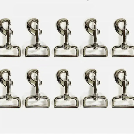 Shiny silver lightweight trigger clips made of metal arranged in two rows perfect as horse rug clips and horse tack accessories