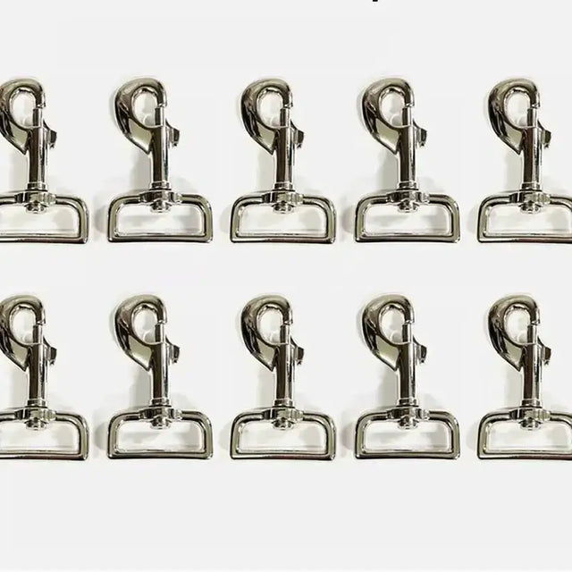 Shiny silver lightweight trigger clips made of metal arranged in two rows perfect as horse rug clips and horse tack accessories