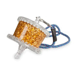 Transparent plastic spool filled with golden glittery seeds attached to colorful braided cord for likit granola rock hard formulation