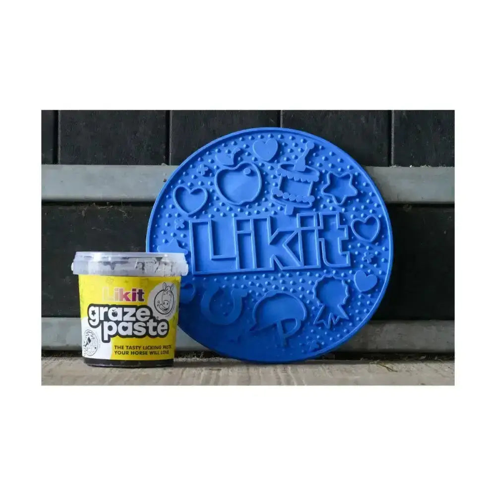 Blue circular silicone slow feeding lick mat with embossed hearts apples and likit for tasty likit graze maze
