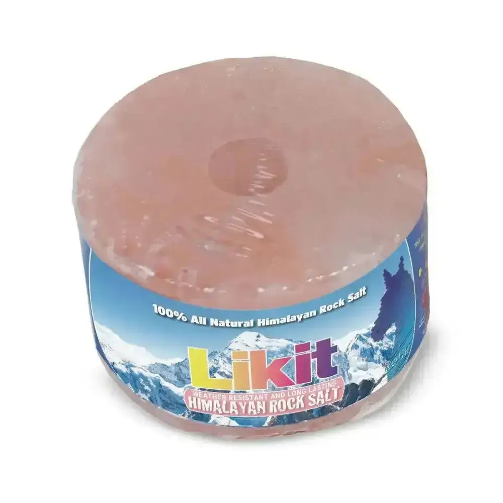 A round pink himalayan rock salt block wrapped in plastic with likit branding and mountain imagery