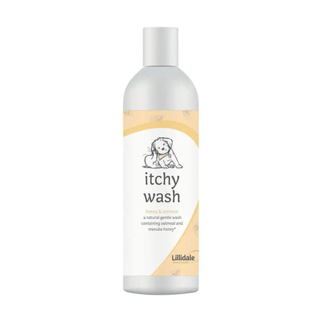 A clear plastic bottle with silver cap labeled lillidale itchy wash featuring a puppy and manuka honey on white beige label