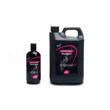 Black plastic bottles of lillidale medicated shampoo with pink horse label featuring mild anti-bacterial agent