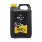 Black plastic jug with yellow cap and handle labeled lincoln blood tonic a perfectly balanced daily tonic for horse vitamins