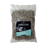 A clear plastic bag with beige cube-shaped lincoln herb stix dog treats from encoin for added palatability