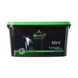 Black plastic tub with green lid labeled lincoln herbs mint natural horse vitamins with pure spearmint support