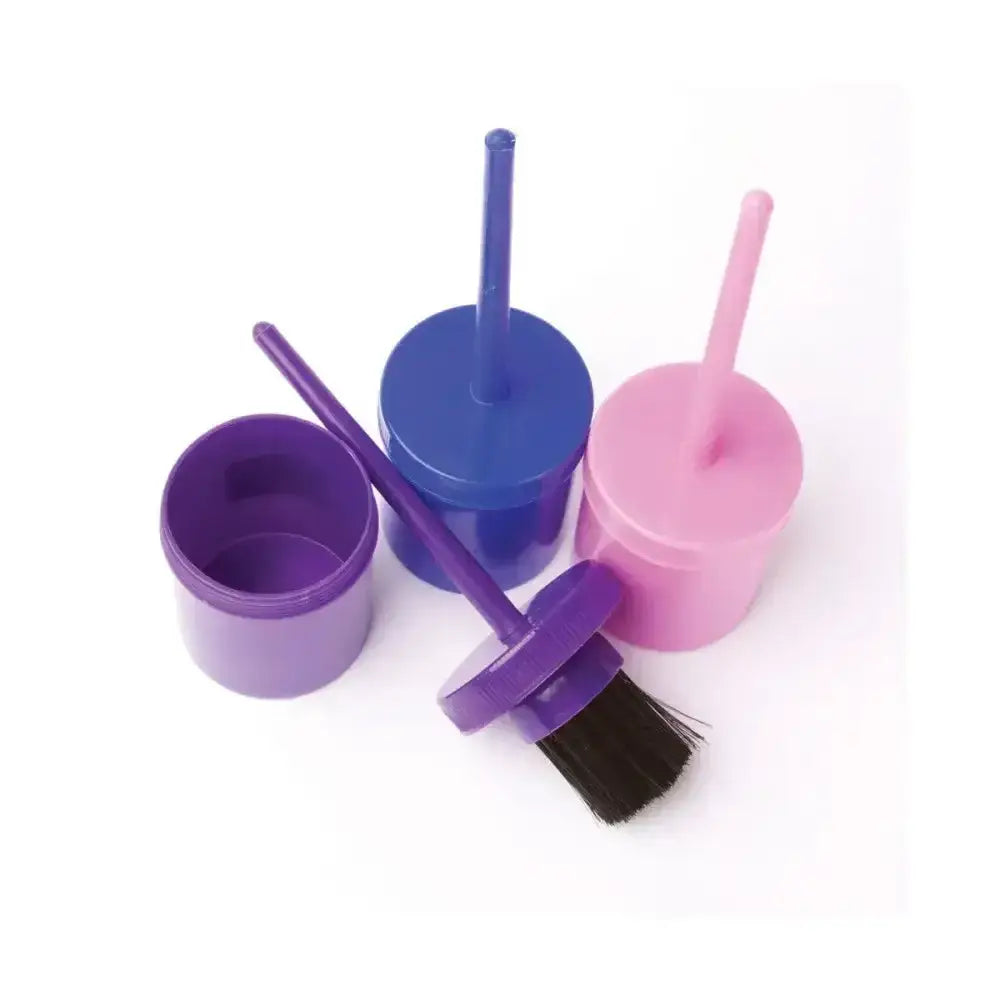 Purple plastic lincoln hoof oil brush with black bristles resting next to a matching open container oil brush complete