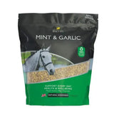 Black and green resealable lincoln mint horse feed pouch with a white horse image and gold garlic pellets visible for equestrian use