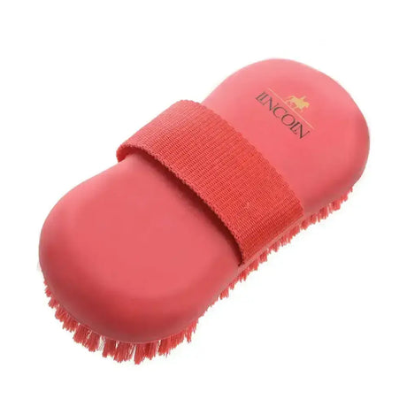 Pink lincoln oval wash brush with soft wash brush bristles and a textured strap for easy grip