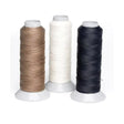 Three spools of lincoln plaiting thread reel in tan white and black satin finish polyester for durable stitching