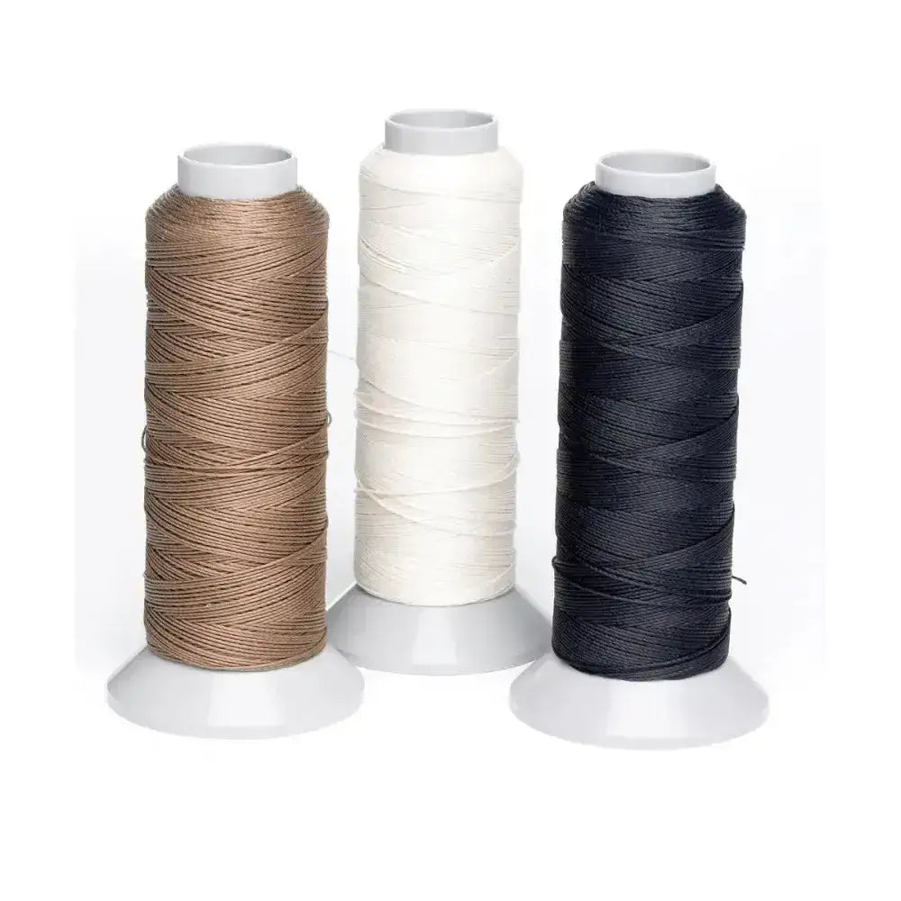 Three lincoln plaiting thread reels in tan white and black satin finish polyester plaiting thread reel