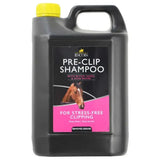 Black plastic jug with yellow cap and pink label of lincoln pre clip shampoo for time saving clipping
