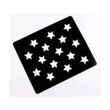 Black star-shaped lincoln quarter markers with white cut-out stars on matte surface for ring finish and horse grooming