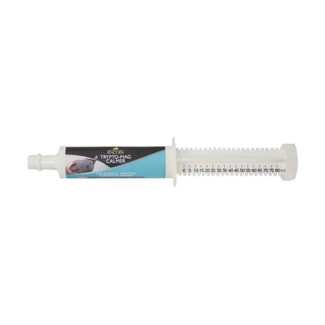 White plastic syringe labeled incogn trypto-mag calmer by lincoln trypto-mag calmer for calming neurotransmitter serotonin in spooky horses