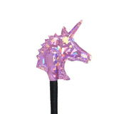 A shimmering pink unicorn shimmer riding charm with pointed horn and spiky mane on a black elastic band by elico