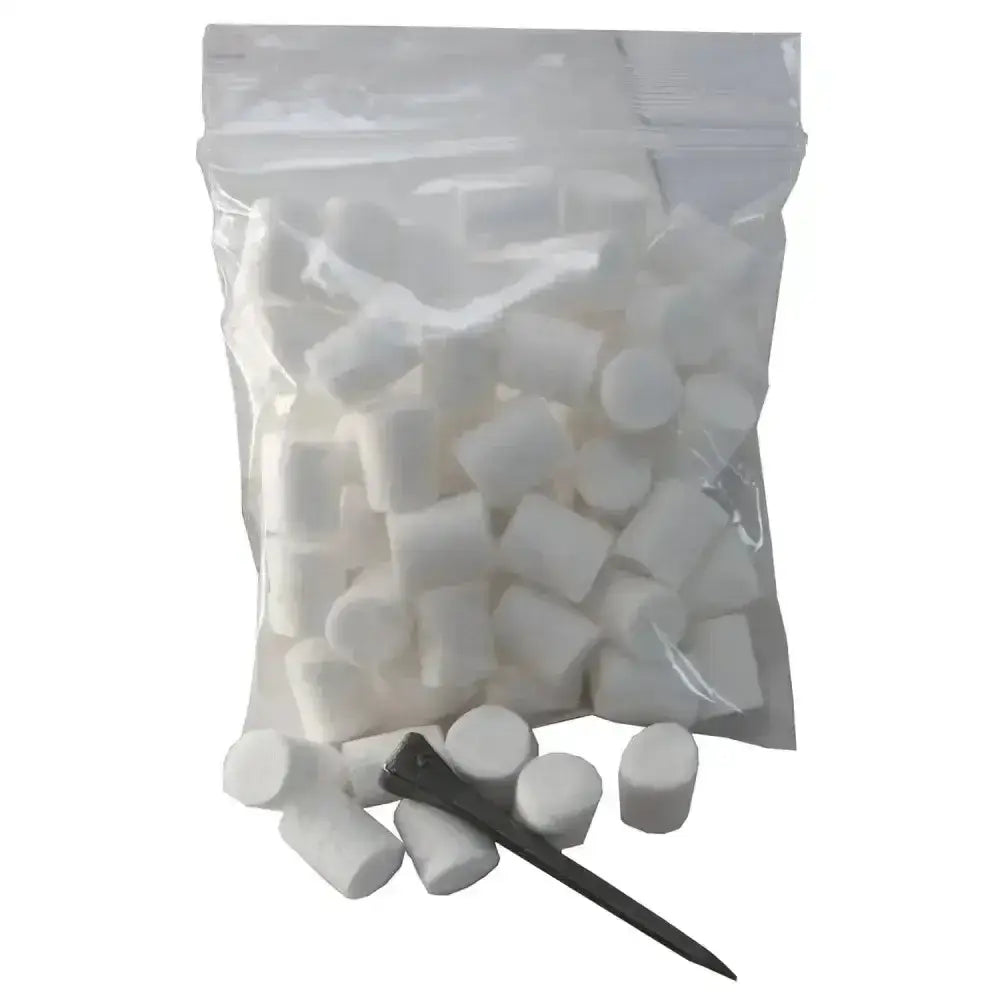 A clear bag with white cylindrical foam liveryman cotton stud plugs and a single black nail for horse tack use