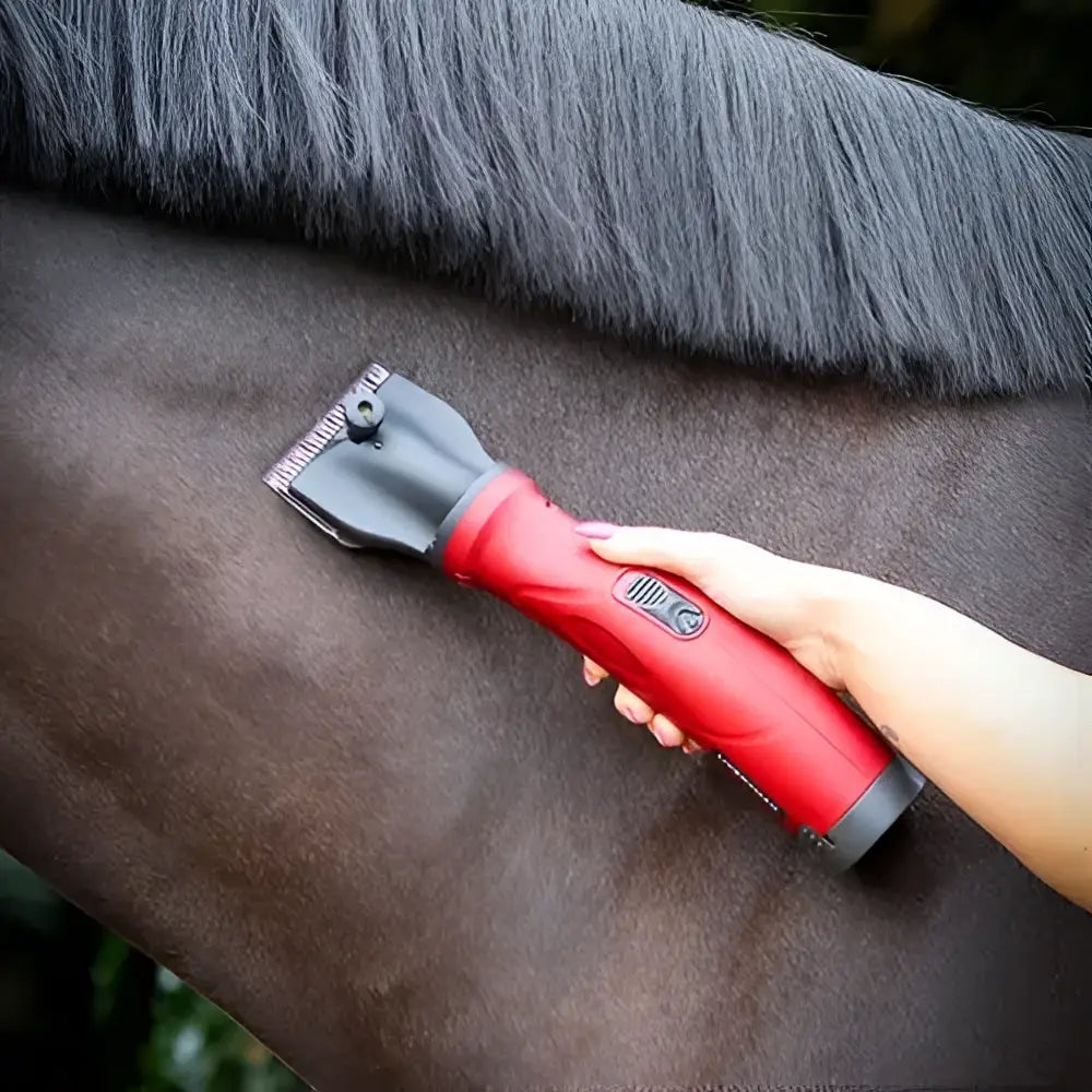 Red and black liveryman phoenix horse clipper with textured grip handle for easy grooming use