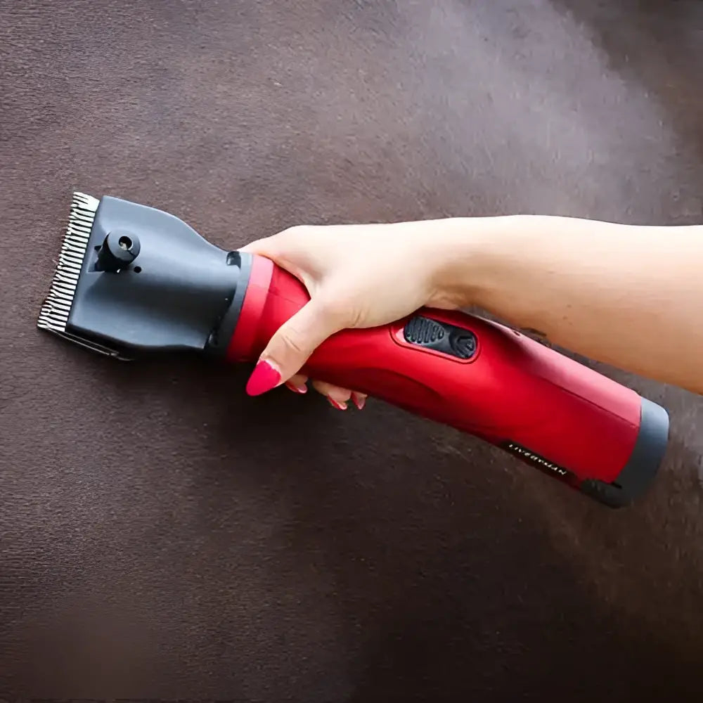 Red and black liveryman phoenix horse electric clipper with metallic comb attachment for precise grooming use