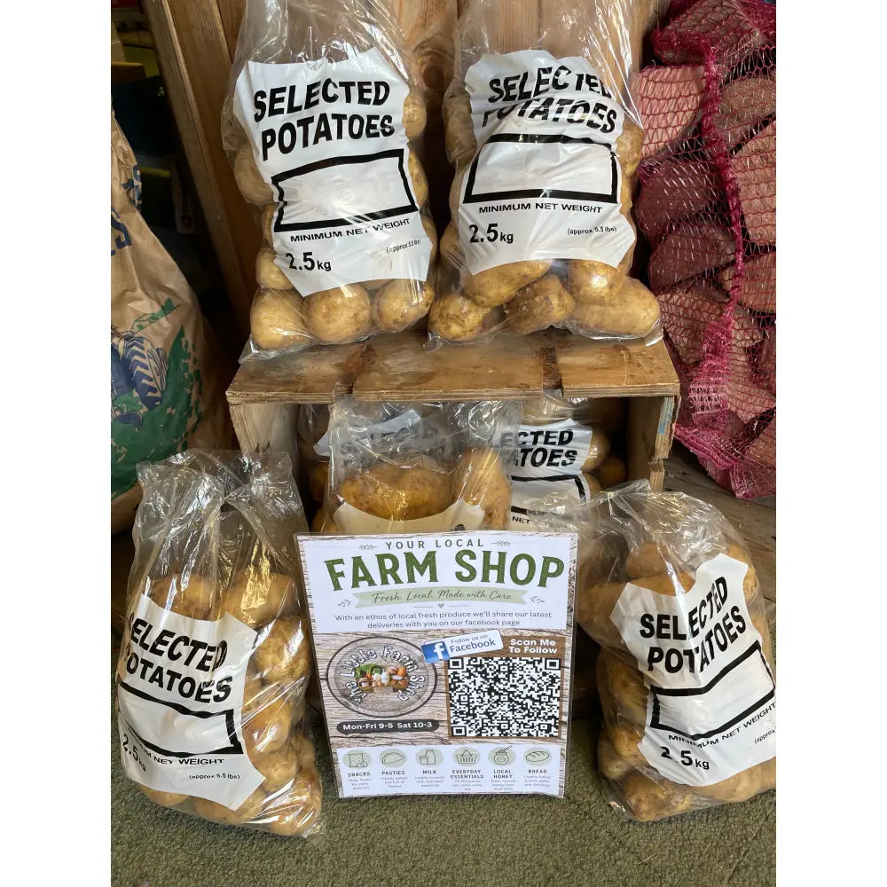 Clear plastic bags filled with locally grown wilja potatoes labeled selected potatoes 2.5kg net weight
