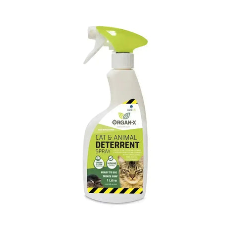 A white plastic spray bottle with lime green trigger and label of lodi organ-x cat vertebrate repellent with aluminium ammonium sulphate