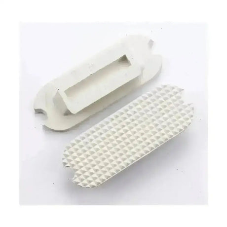 White ceramic lorina stirrup treads mold with diamond-patterned base and rectangular cavity for stirrup treads fillis