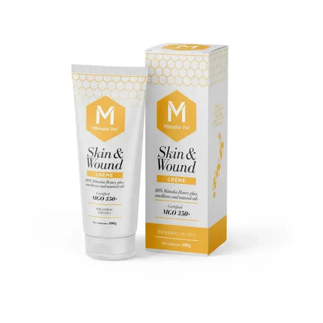 White tube and matching box of manuka vet skin wound creme with honeycomb design and gold accents for skin abrasions