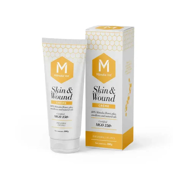 White tube and matching box of manuka vet skin wound creme with honeycomb design and gold accents for skin abrasions