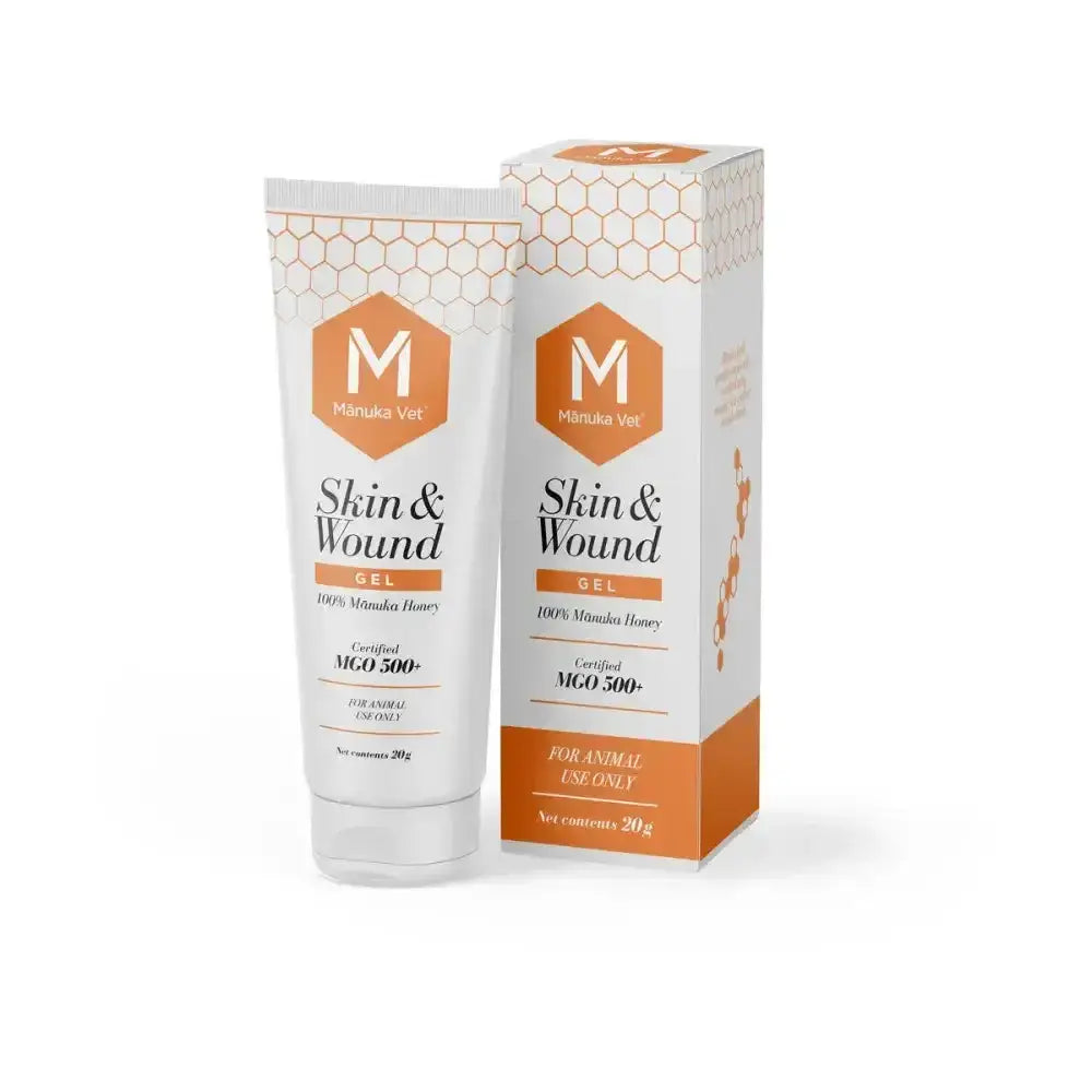 White tube and box of manuka vet skin and wound gel with orange honeycomb branding for skin abrasions care