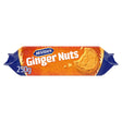 A pack of mcvities ginger nuts wrapped in bright orange and blue foil with a bite taken from the golden biscuit front