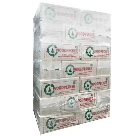 Stack of white cardboard boxes with mendip woodpecker small flake woodshavings horse bedding wrapped in clear plastic