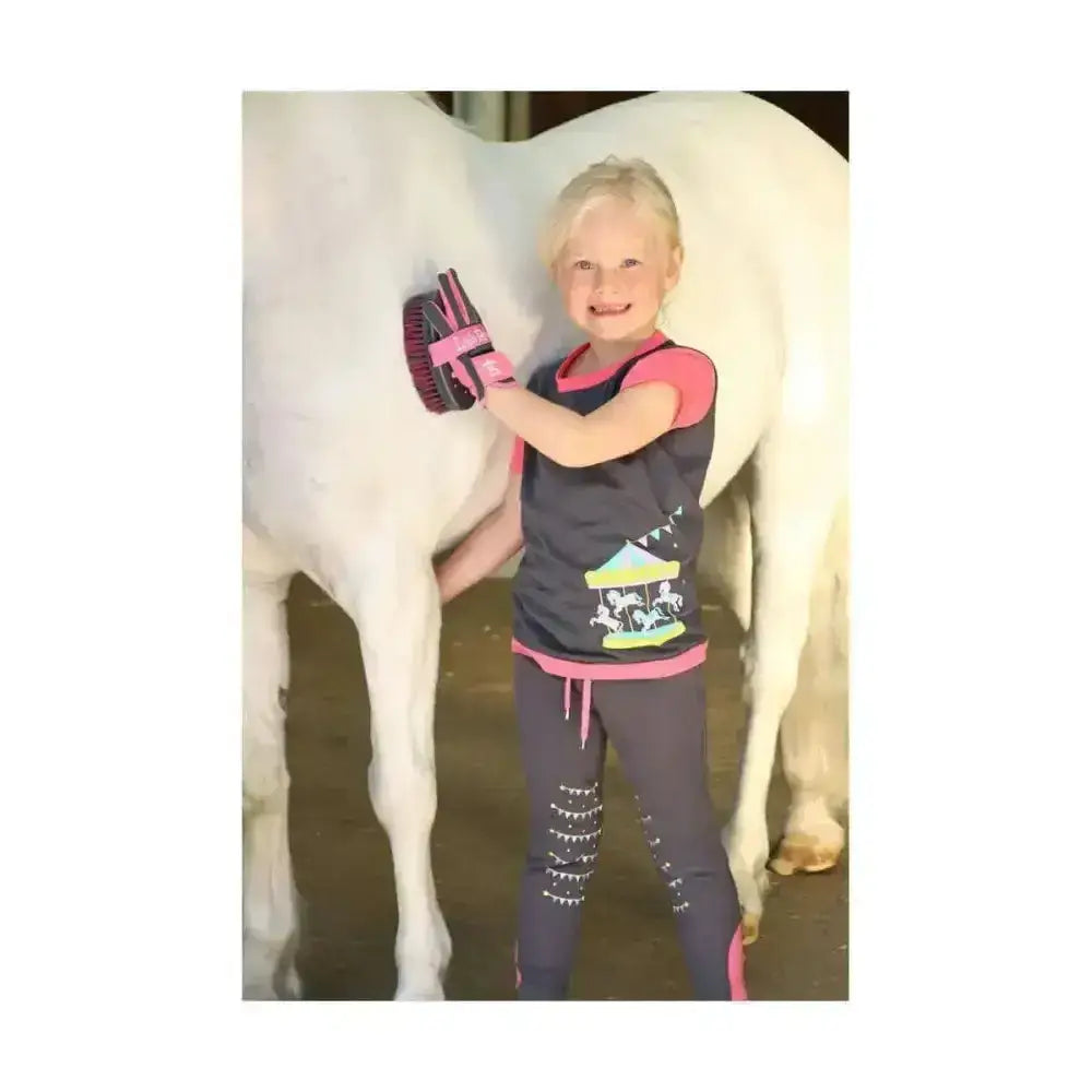 Pink and black horse grooming brush with padded grip designed to secure fit allowing you to enjoy riding comfortably
