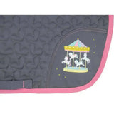 Dark gray quilted merry go round saddle pad with pink border and embroidered white horses by little rider