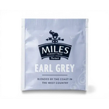 A silver foil earl grey envelope teabag packet from miles tea featuring an elephant and compass design in white text