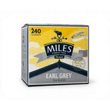 Yellow and gray box of miles tea earl grey teabags with italian bergamot oil featuring vintage elephant logo and compass rose