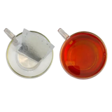 Transparent glass tea cup with brewed earl grey tea made from miles tea earl bergamot oil teabags