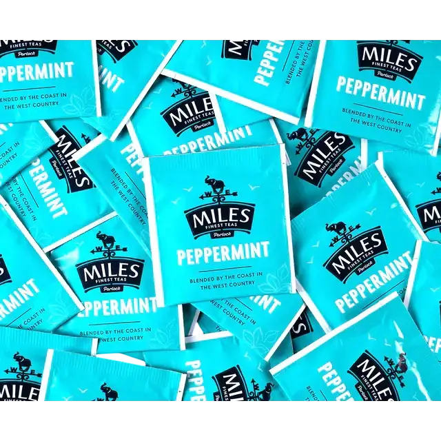 Bright turquoise miles tea envelope peppermint teabags with black branding and real peppermint leaves logo