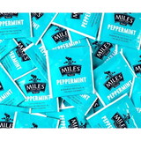 Bright turquoise miles tea envelope peppermint teabags with black branding and real peppermint leaves logo
